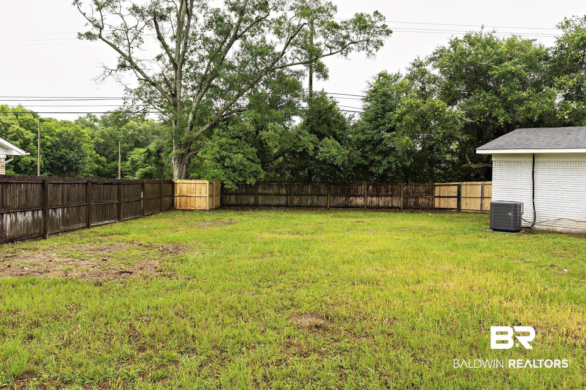 5922 Sunnyside Drive Mobile, AL 36619 - Photo 46 of 51 View of yard featuring central air condition unit