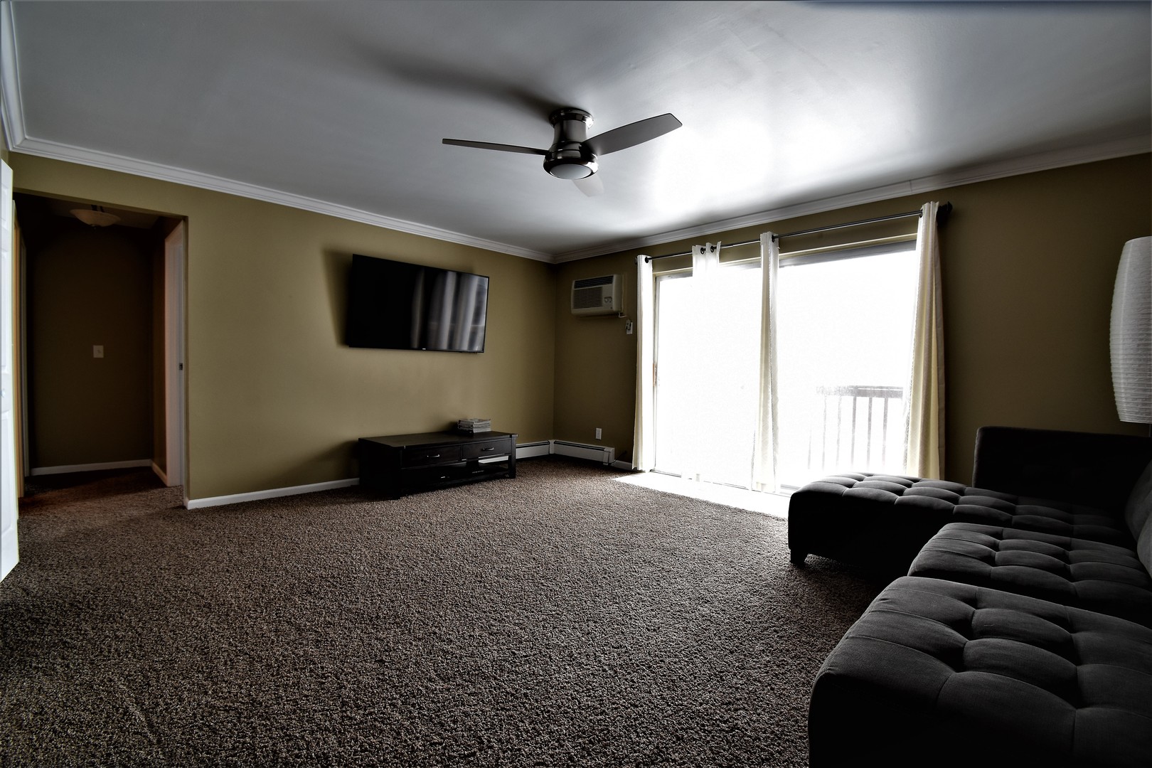 19330 Wolf Road, Unit 5 Mokena, IL 60448 - Photo 2 of 25 a living room with furniture and a flat screen tv