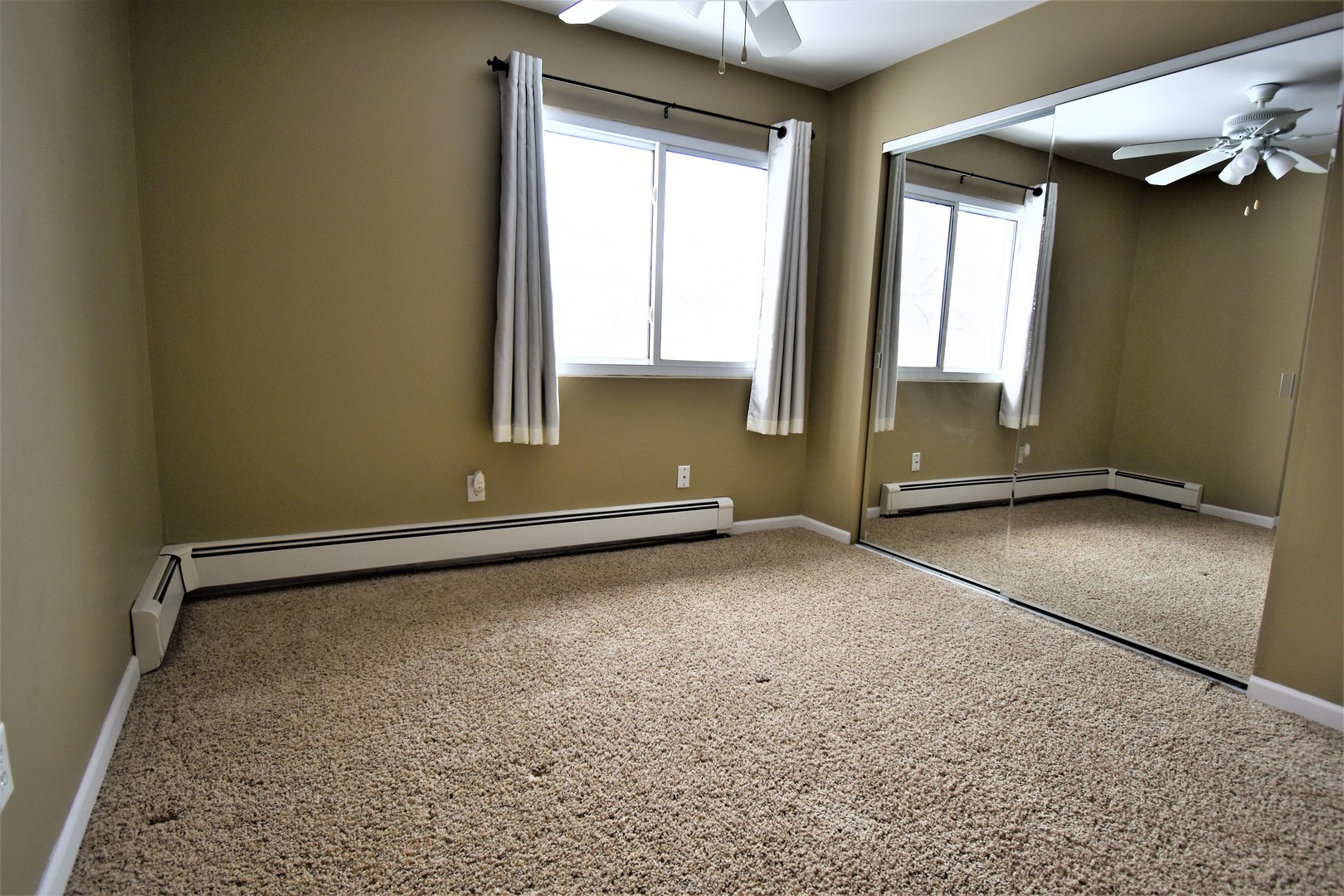 19330 Wolf Road, Unit 5 Mokena, IL 60448 - Photo 15 of 25 an empty room with a empty space and windows