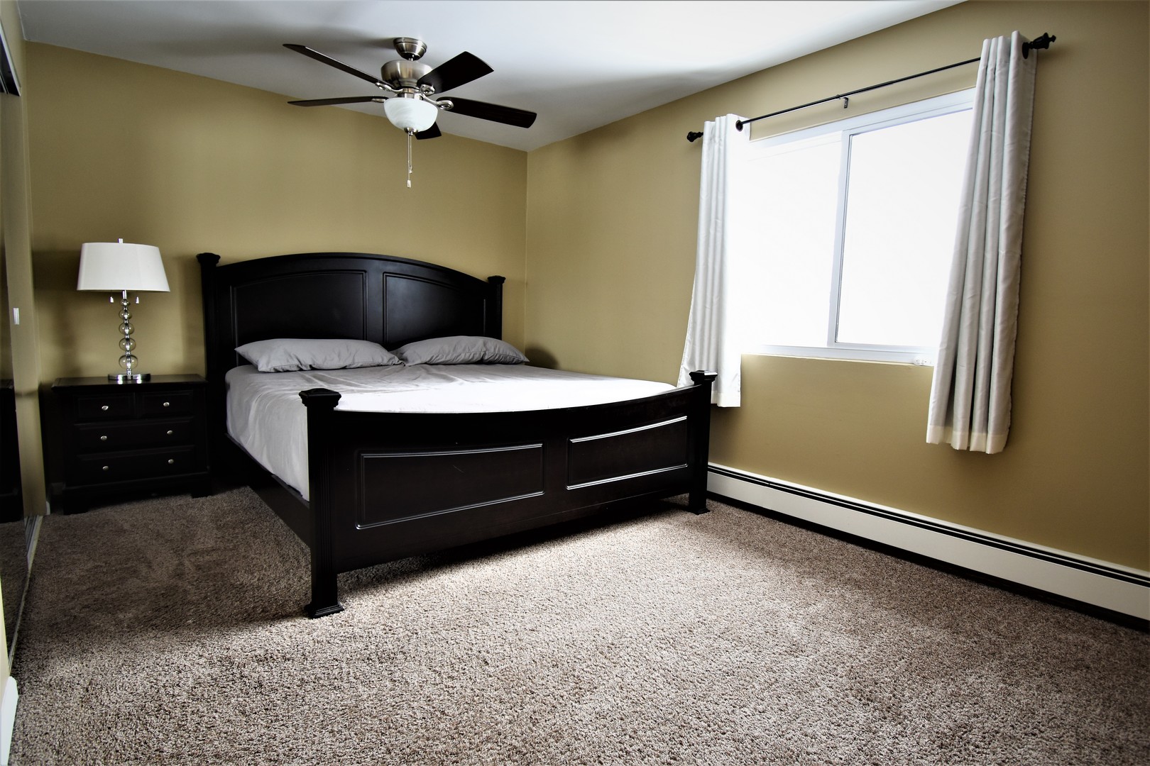 19330 Wolf Road, Unit 5 Mokena, IL 60448 - Photo 17 of 25 a bedroom with a bed and a window