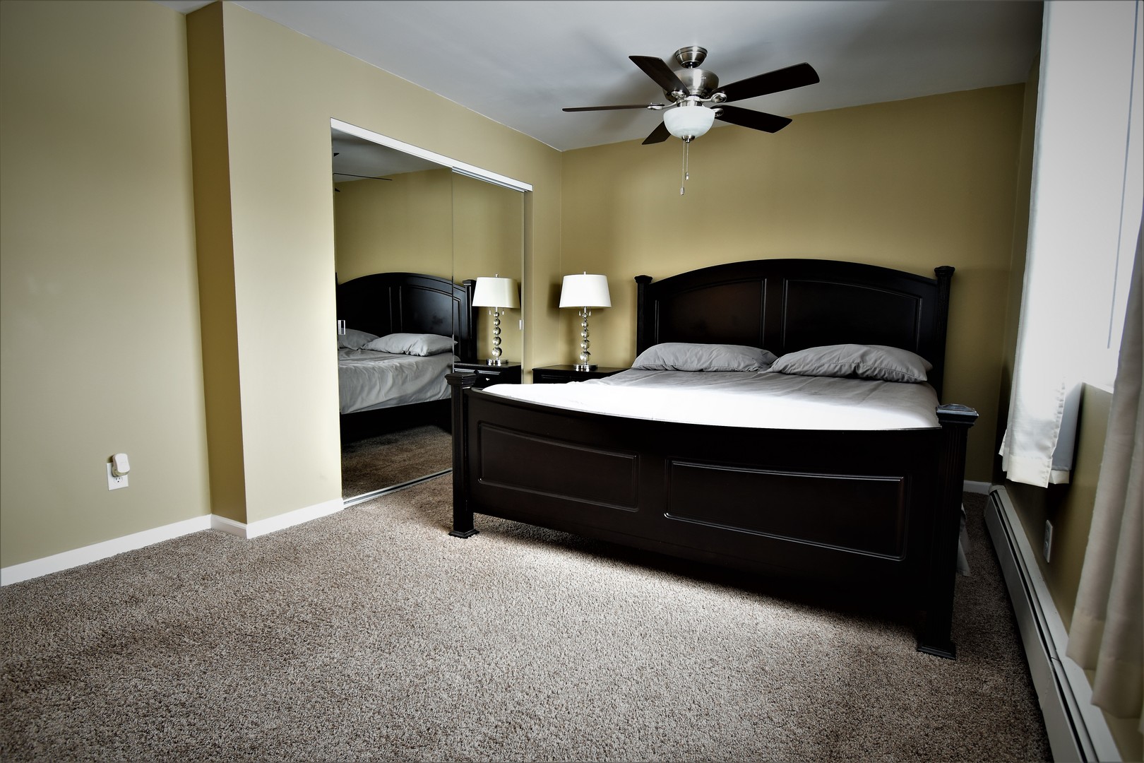 19330 Wolf Road, Unit 5 Mokena, IL 60448 - Photo 18 of 25 a bedroom with a bed and a ceiling fan
