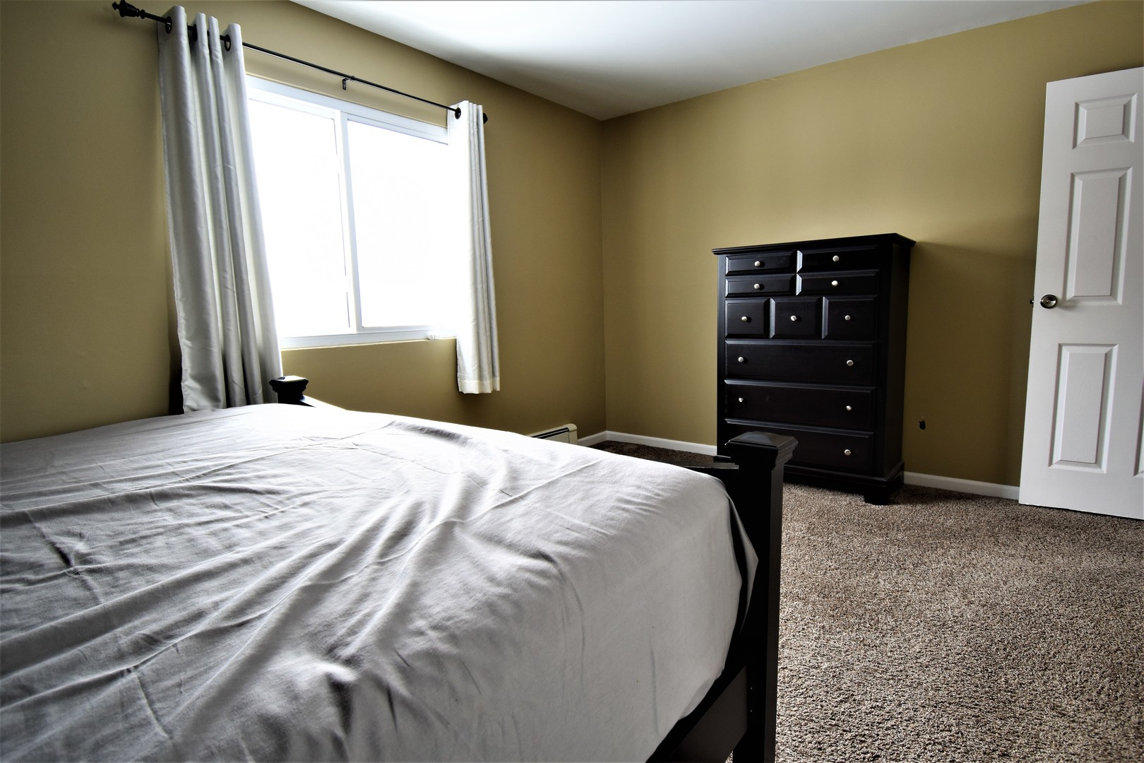 19330 Wolf Road, Unit 5 Mokena, IL 60448 - Photo 19 of 25 a bedroom with a bed and a dresser