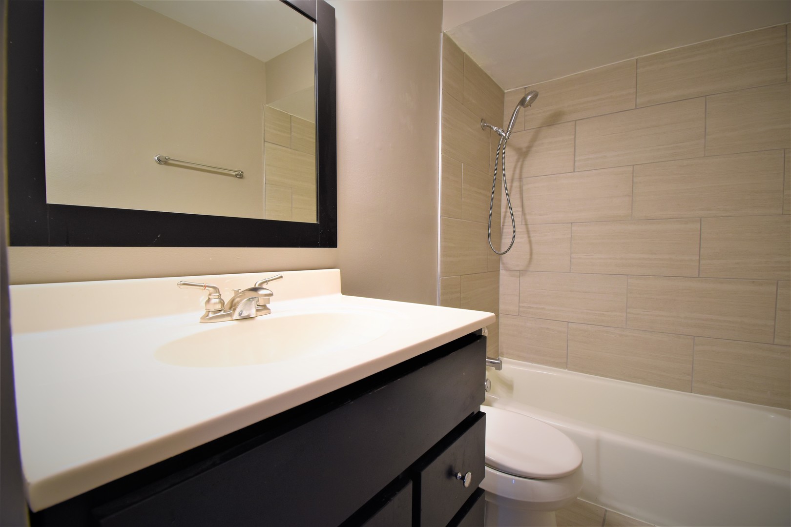 19330 Wolf Road, Unit 5 Mokena, IL 60448 - Photo 20 of 25 a bathroom with a sink a toilet and shower