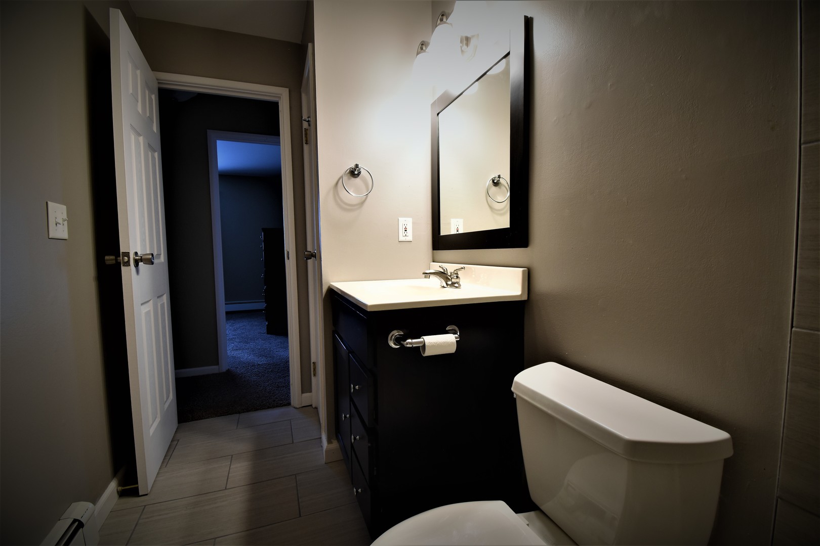 19330 Wolf Road, Unit 5 Mokena, IL 60448 - Photo 23 of 25 a bathroom with a toilet sink and mirror