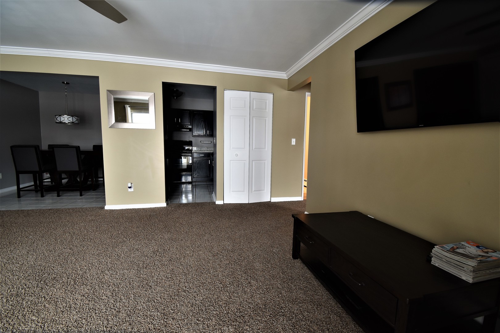 19330 Wolf Road, Unit 5 Mokena, IL 60448 - Photo 5 of 25 a living room with furniture and a flat screen tv