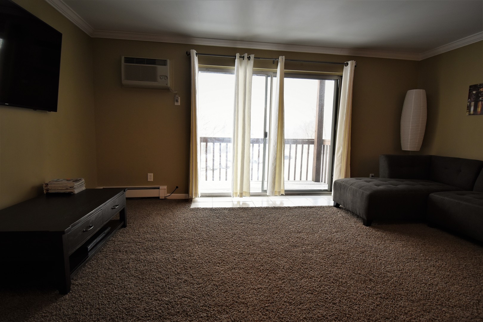 19330 Wolf Road, Unit 5 Mokena, IL 60448 - Photo 6 of 25 a living room with furniture and a flat screen tv