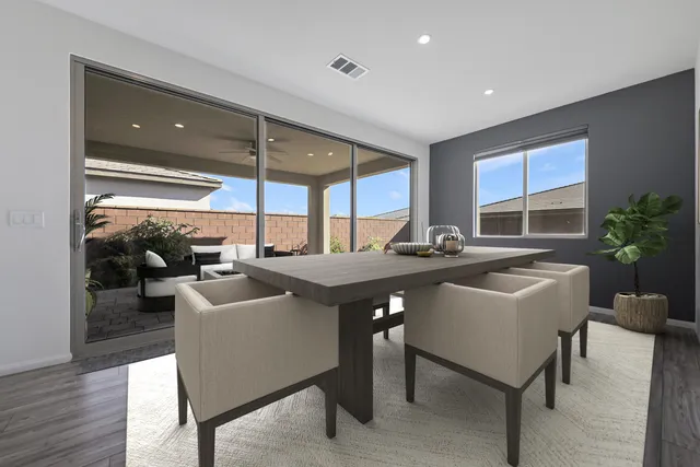 a kitchen with a table and chairs