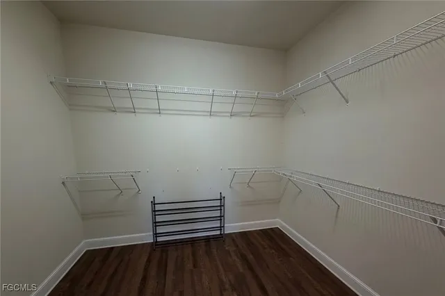 a bedroom with bed and a window