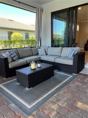 a view of a dining room with furniture one side kitchen view
