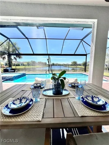 a view of a chairs and tables in the backyard