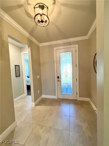 a large kitchen with cabinets and a table