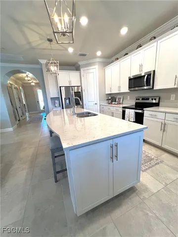 a dining room with a table chairs and a chandelier