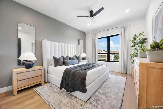 a bed room with bed and a large window