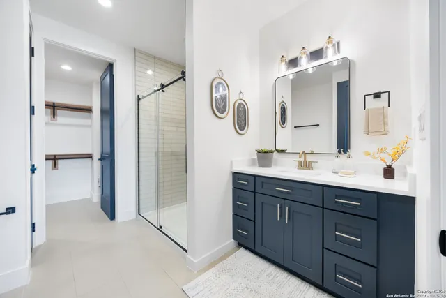 a bathroom with a double vanity sink and a mirror