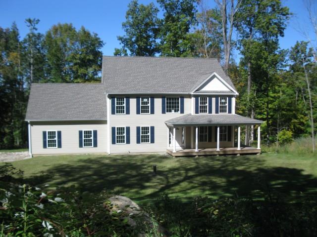 17 Reservoir Road New Milford, CT 06776 - Photo 1 of 1 a front view of a house with a garden