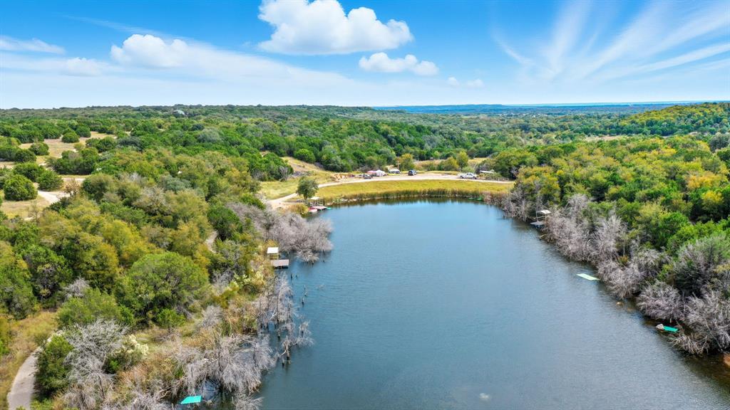 4636 Halsell Ranch Road Jacksboro, TX 76458 - Photo 21 of 40 a view of a lake with a yard