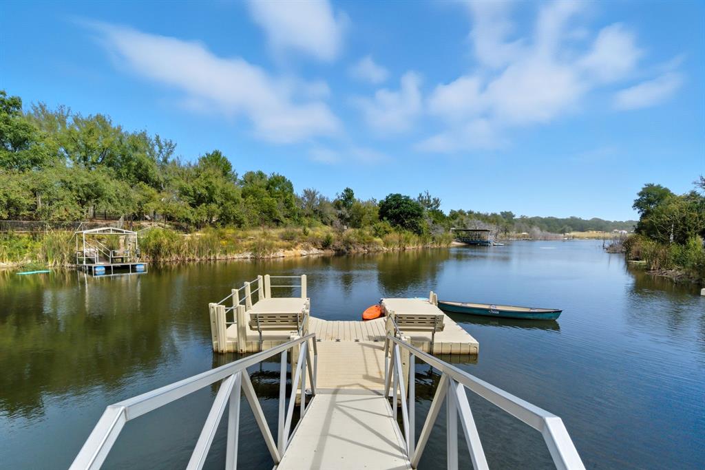 4636 Halsell Ranch Road Jacksboro, TX 76458 - Photo 25 of 40 a view of a lake with couches chairs