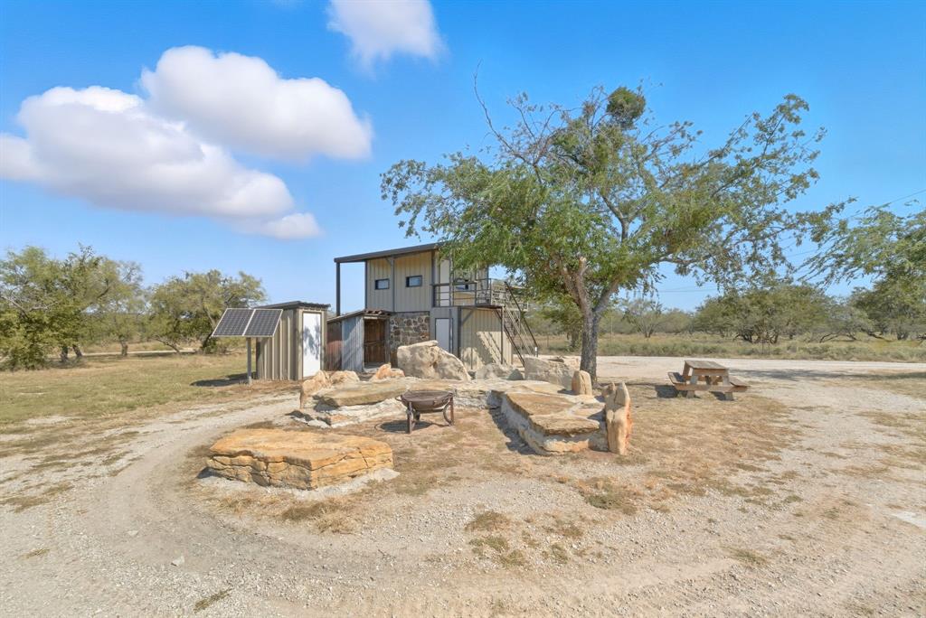 4636 Halsell Ranch Road Jacksboro, TX 76458 - Photo 28 of 40 a view of a backyard of a house