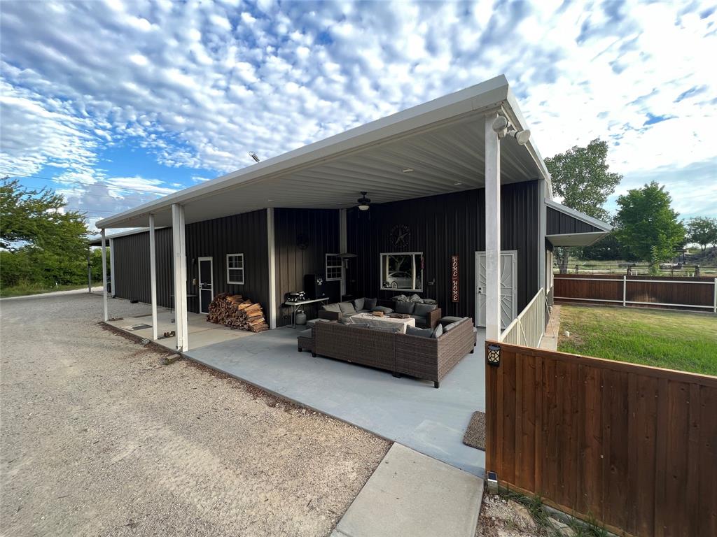 4636 Halsell Ranch Road Jacksboro, TX 76458 - Photo 37 of 40 a view of a house with backyard and porch