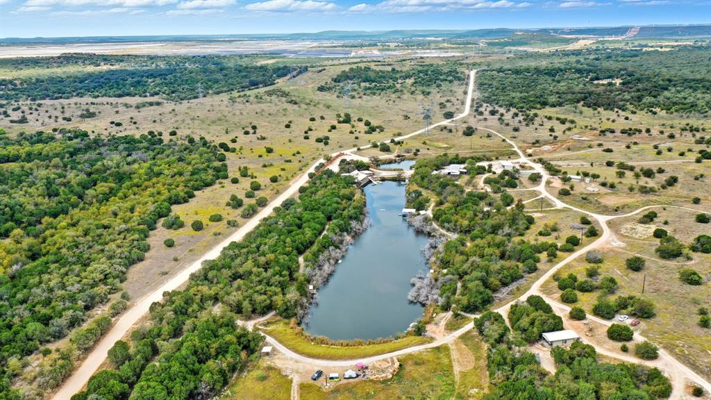 4636 Halsell Ranch Road Jacksboro, TX 76458 - Photo 7 of 40 a view of a lake with a mountain