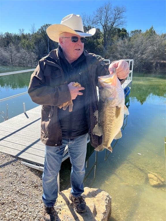 4636 Halsell Ranch Road Jacksboro, TX 76458 - Photo 10 of 40 a view of a wooden deck with lake view