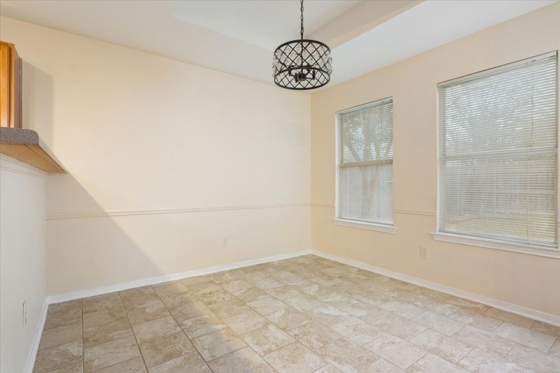 314 Katy Crossing Georgetown, TX 78626 - Photo 12 of 38 a view of empty room with window and ceiling fan