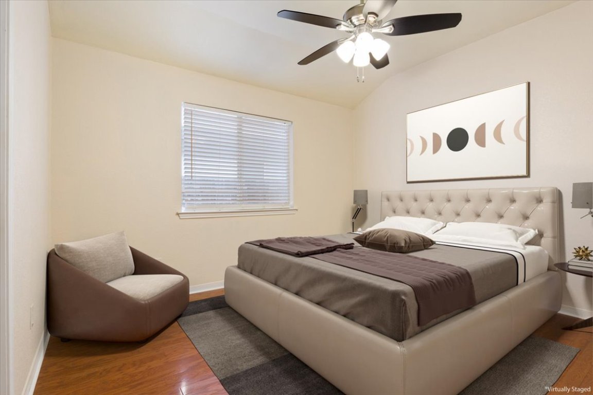 314 Katy Crossing Georgetown, TX 78626 - Photo 18 of 38 a bedroom with bed couch and window