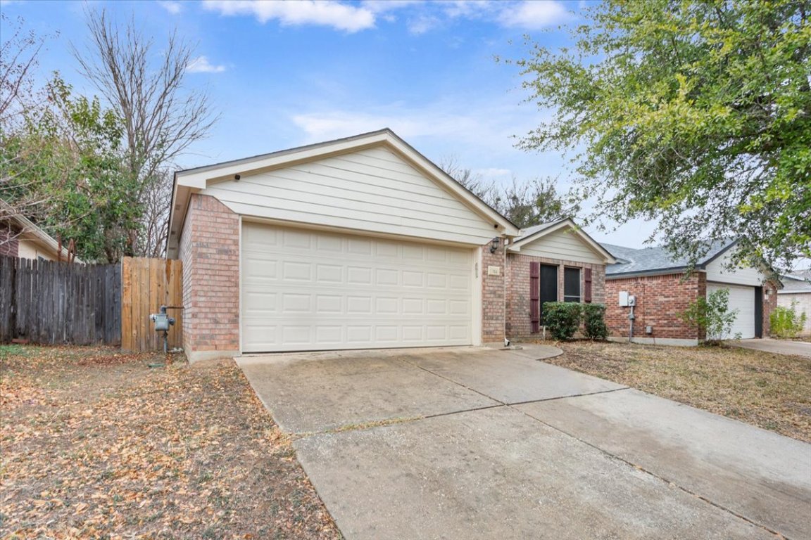 314 Katy Crossing Georgetown, TX 78626 - Photo 3 of 38 a front view of a house with a yard and garage