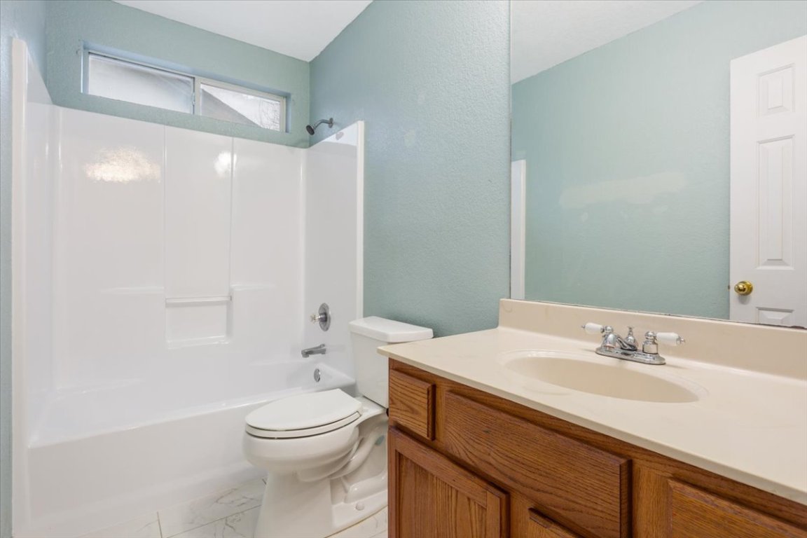 314 Katy Crossing Georgetown, TX 78626 - Photo 31 of 38 a bathroom with a sink a toilet and shower
