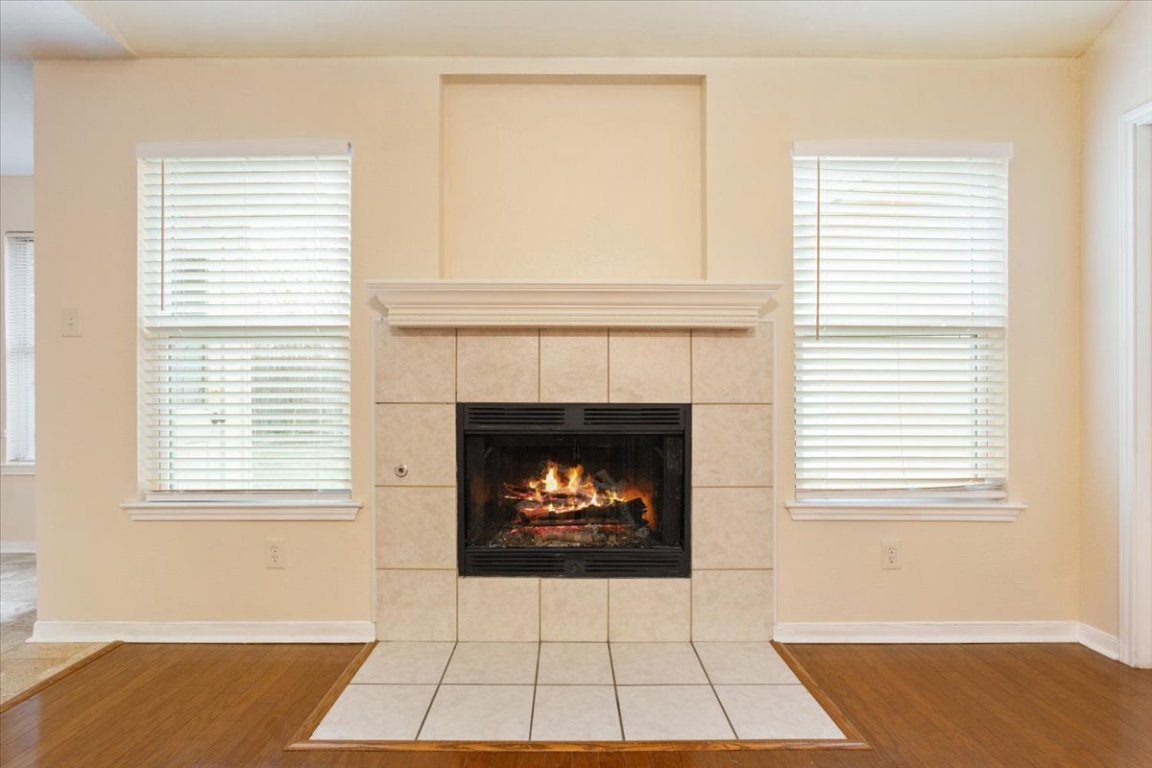 314 Katy Crossing Georgetown, TX 78626 - Photo 8 of 38 a living room with a fireplace and a window