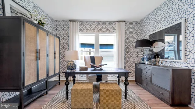 a living room with stainless steel appliances granite countertop furniture and a fireplace