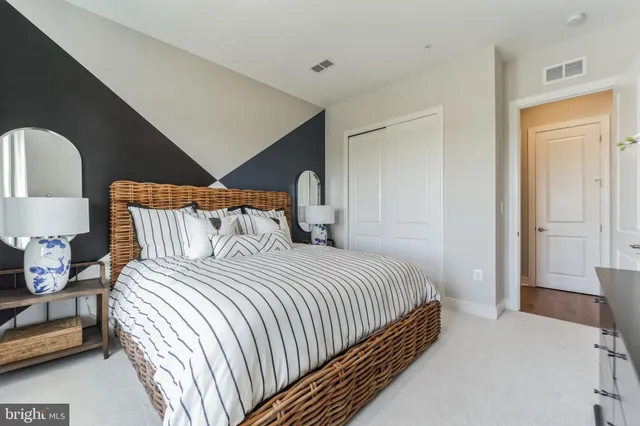 a bedroom with bed and window