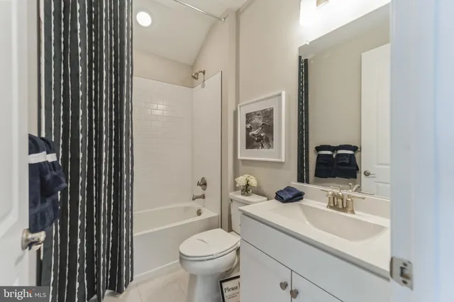 a bathroom with a sink toilet a shower and a mirror