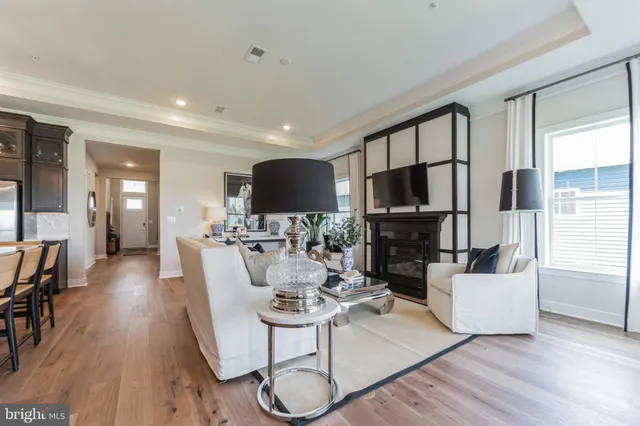 a living room with fireplace furniture and a flat screen tv