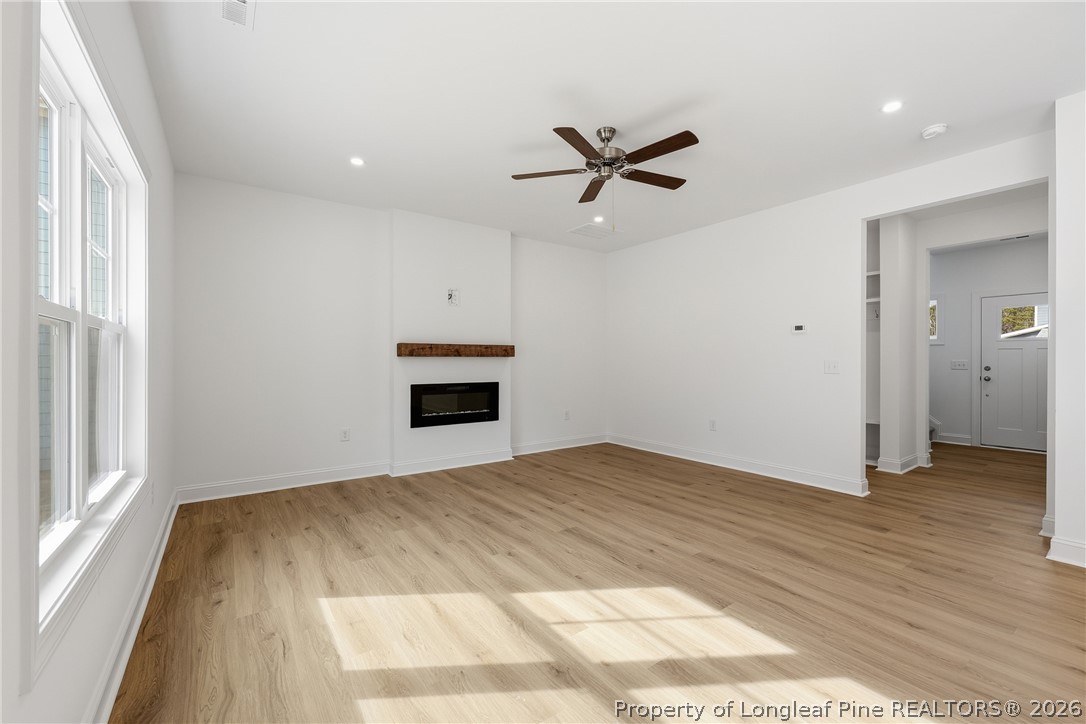 154 Carver Street Carthage, NC 28327 - Photo 13 of 41 a view of empty room with wooden floor and window