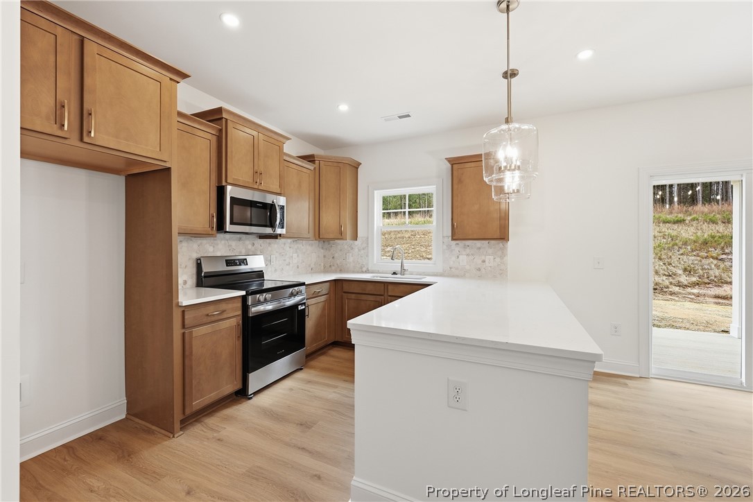 154 Carver Street Carthage, NC 28327 - Photo 18 of 41 a kitchen with a sink stove and microwave