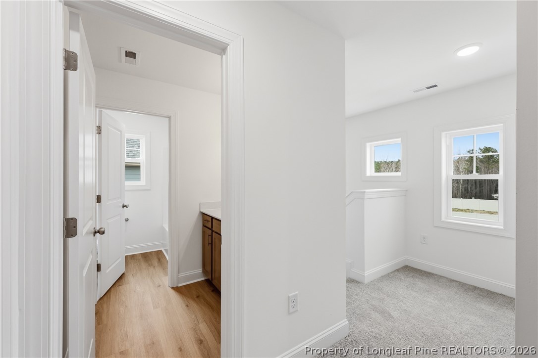 154 Carver Street Carthage, NC 28327 - Photo 26 of 41 a view of an empty room with a fireplace and a window