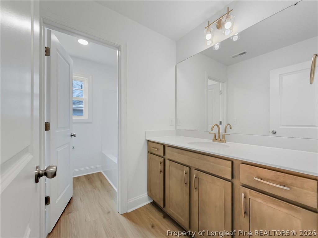 154 Carver Street Carthage, NC 28327 - Photo 27 of 41 a bathroom with a sink double vanity granite tub and shower