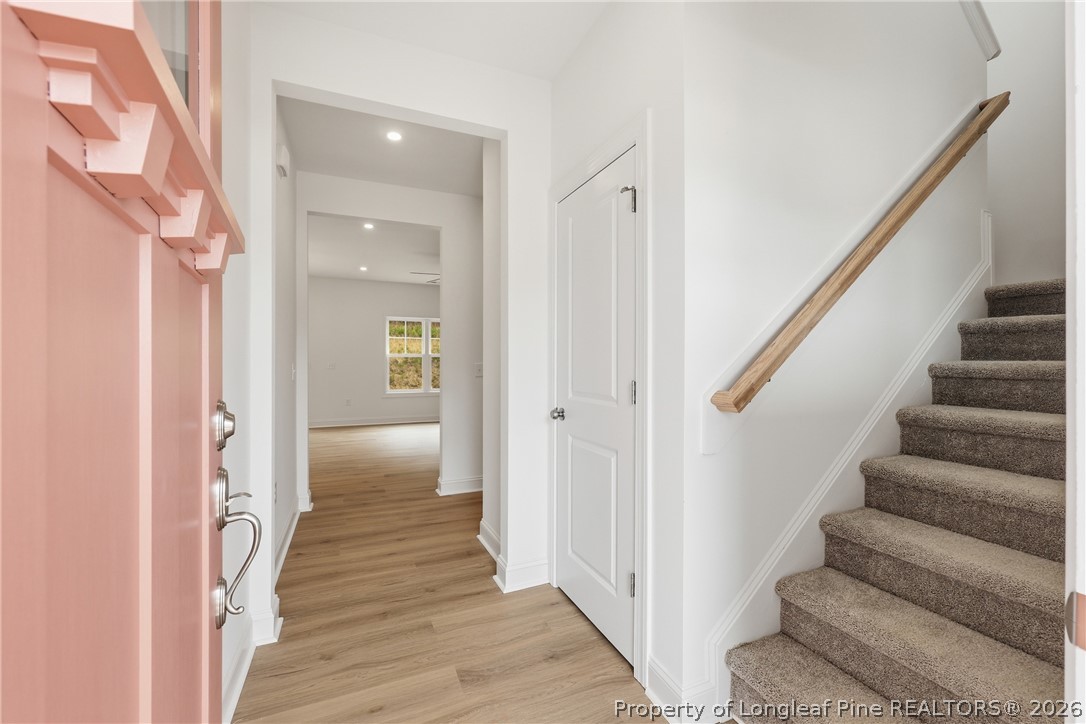 154 Carver Street Carthage, NC 28327 - Photo 6 of 41 a view of a hallway with wooden floor and staircase