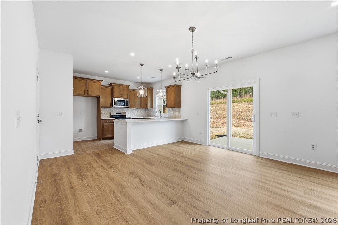 154 Carver Street Carthage, NC 28327 - Photo 10 of 41 a view of a kitchen with microwave and cabinets