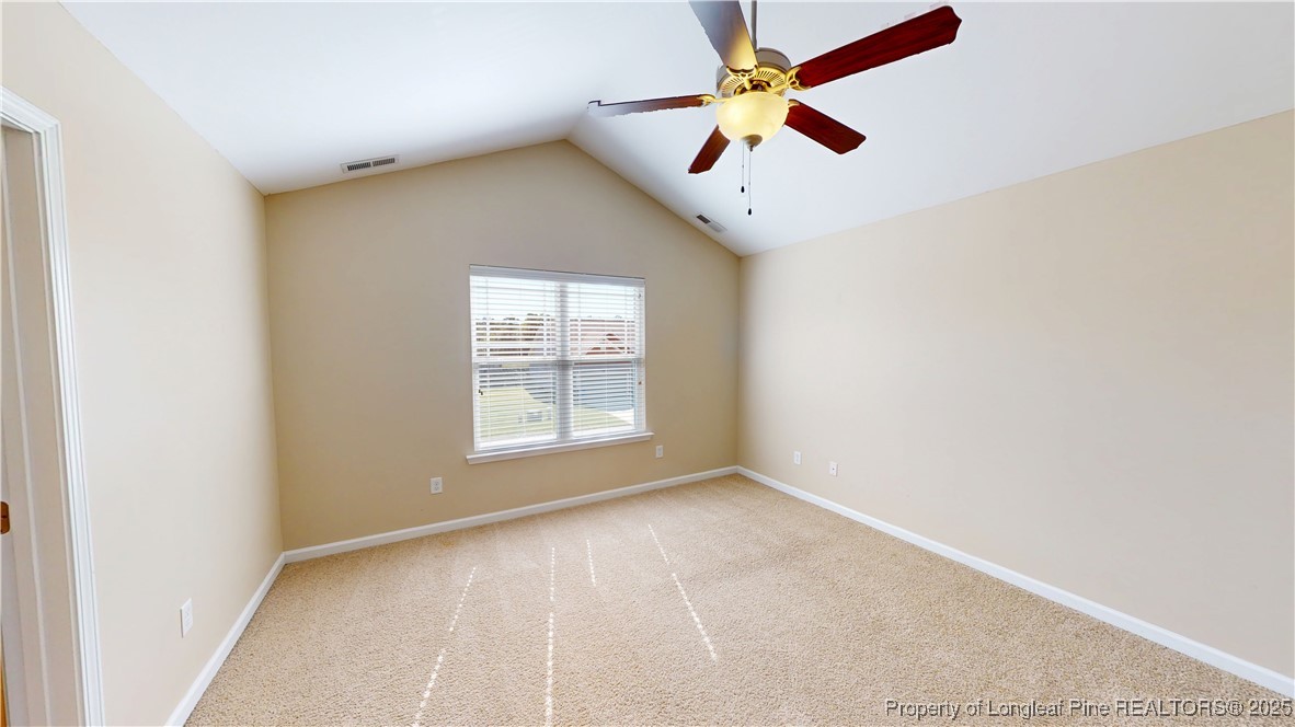 541 Roanoke Drive Raeford, NC 28376 - Photo 15 of 25 an empty room with ceiling fan and window