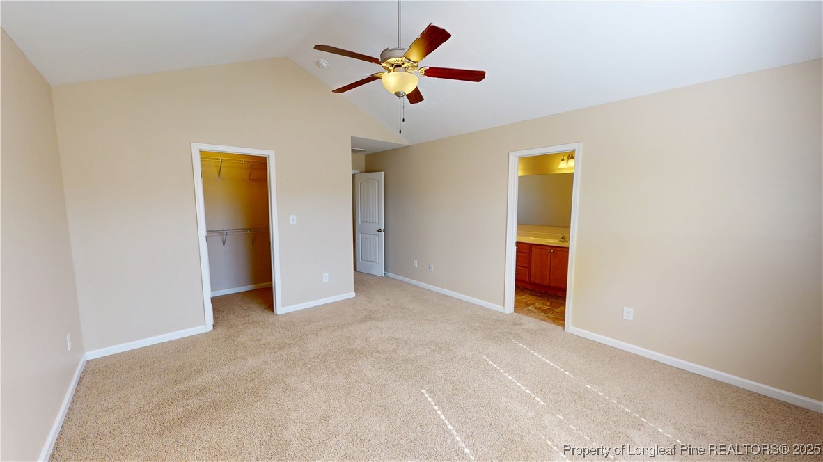 541 Roanoke Drive Raeford, NC 28376 - Photo 16 of 25 a view of an empty room with a ceiling fan