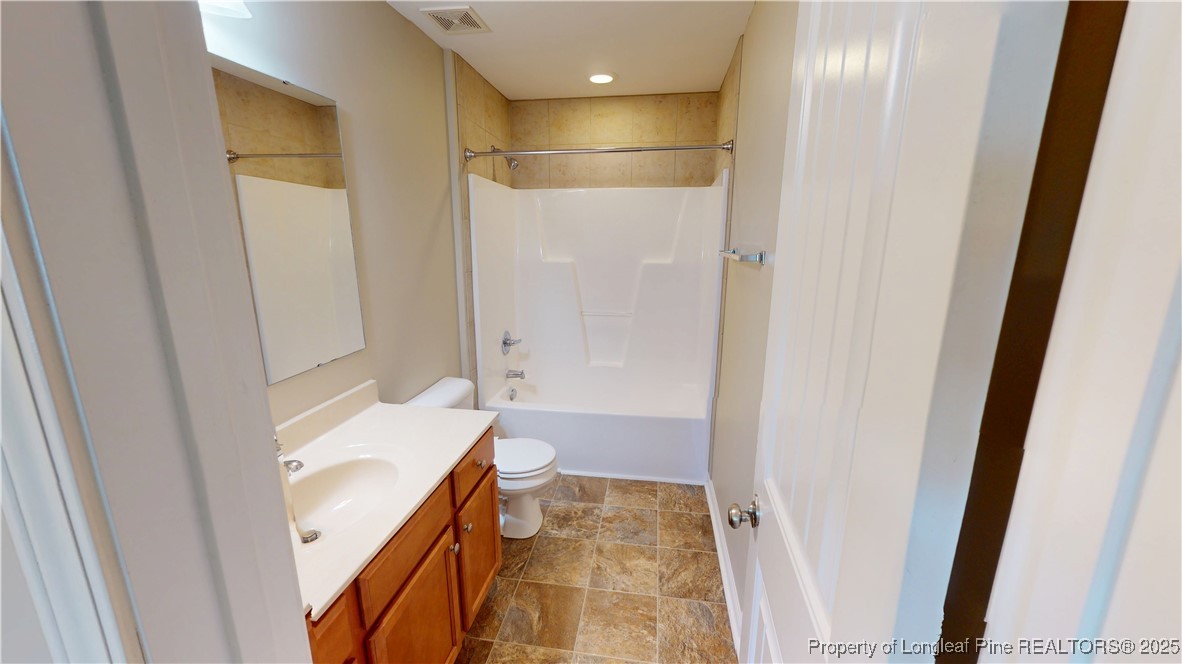 541 Roanoke Drive Raeford, NC 28376 - Photo 22 of 25 a bathroom with a sink and a mirror
