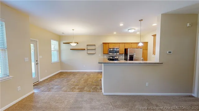 a view of kitchen and windows