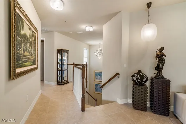 a view of a hallway with stairs