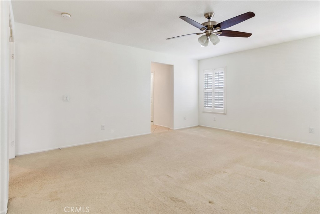 9140 Village Way Riverside, CA 92508 - Photo 25 of 37 an empty room with a window and a fan
