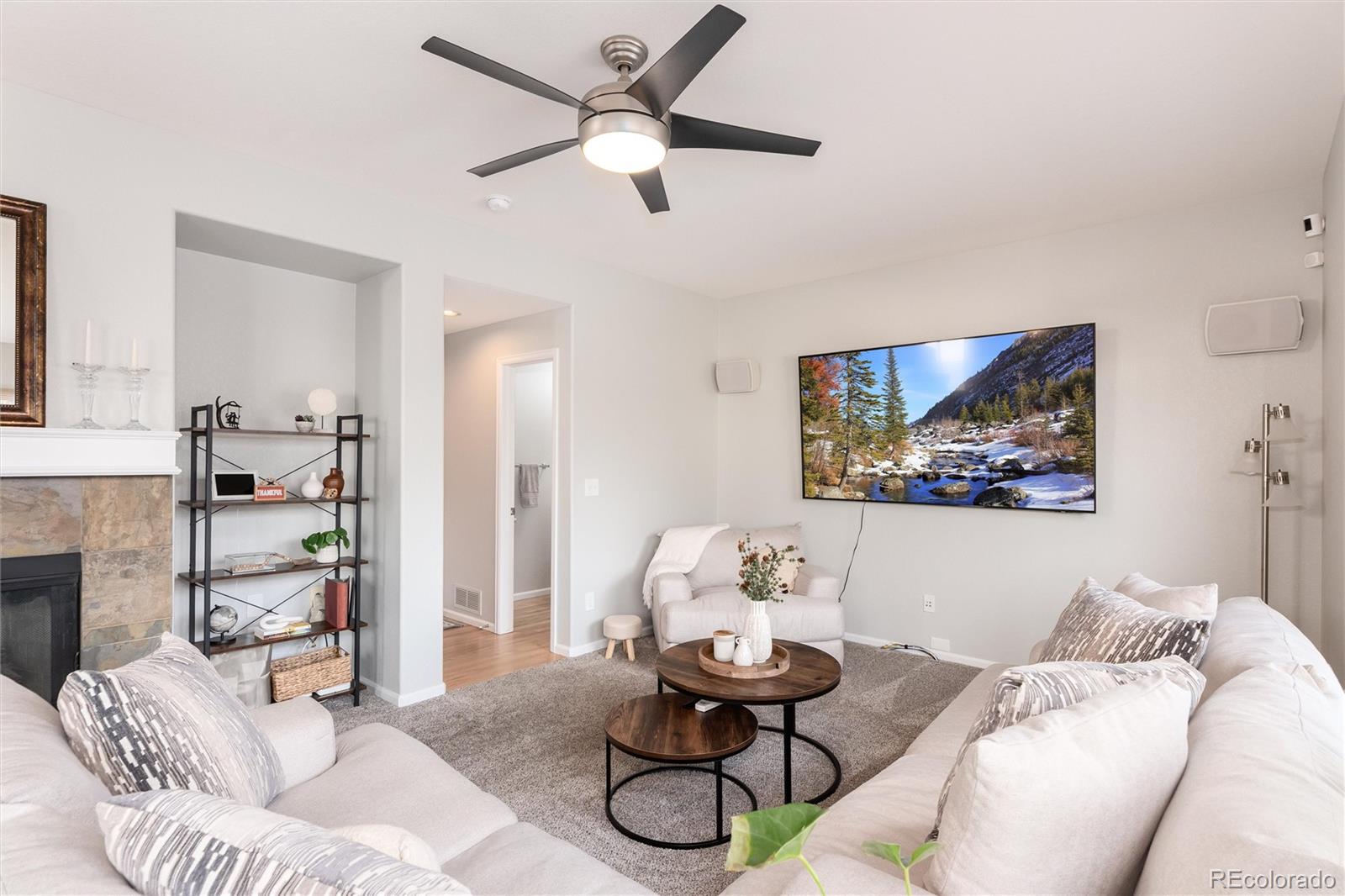10627 Cherrybrook Circle Highlands Ranch, CO 80126 - Photo 20 of 44 a living room with furniture and a chandelier