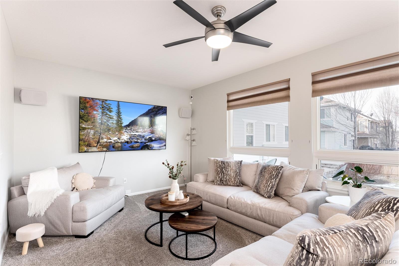10627 Cherrybrook Circle Highlands Ranch, CO 80126 - Photo 21 of 44 a living room with furniture and a large window