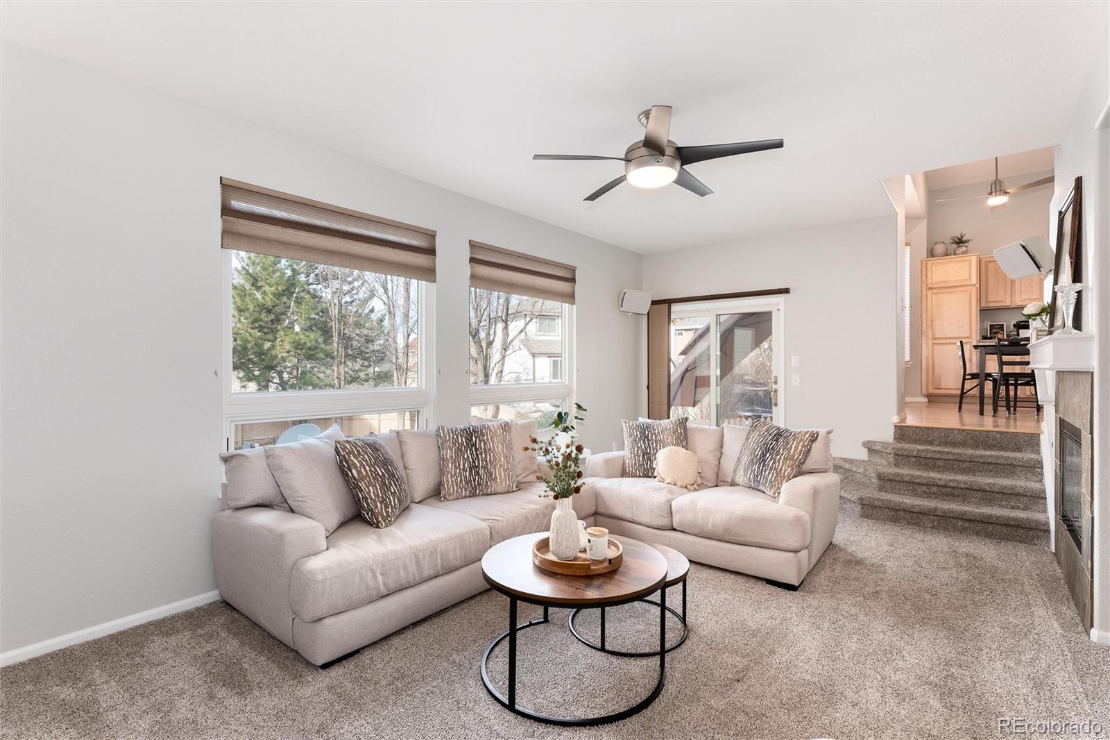 10627 Cherrybrook Circle Highlands Ranch, CO 80126 - Photo 23 of 44 a living room with furniture and a large window