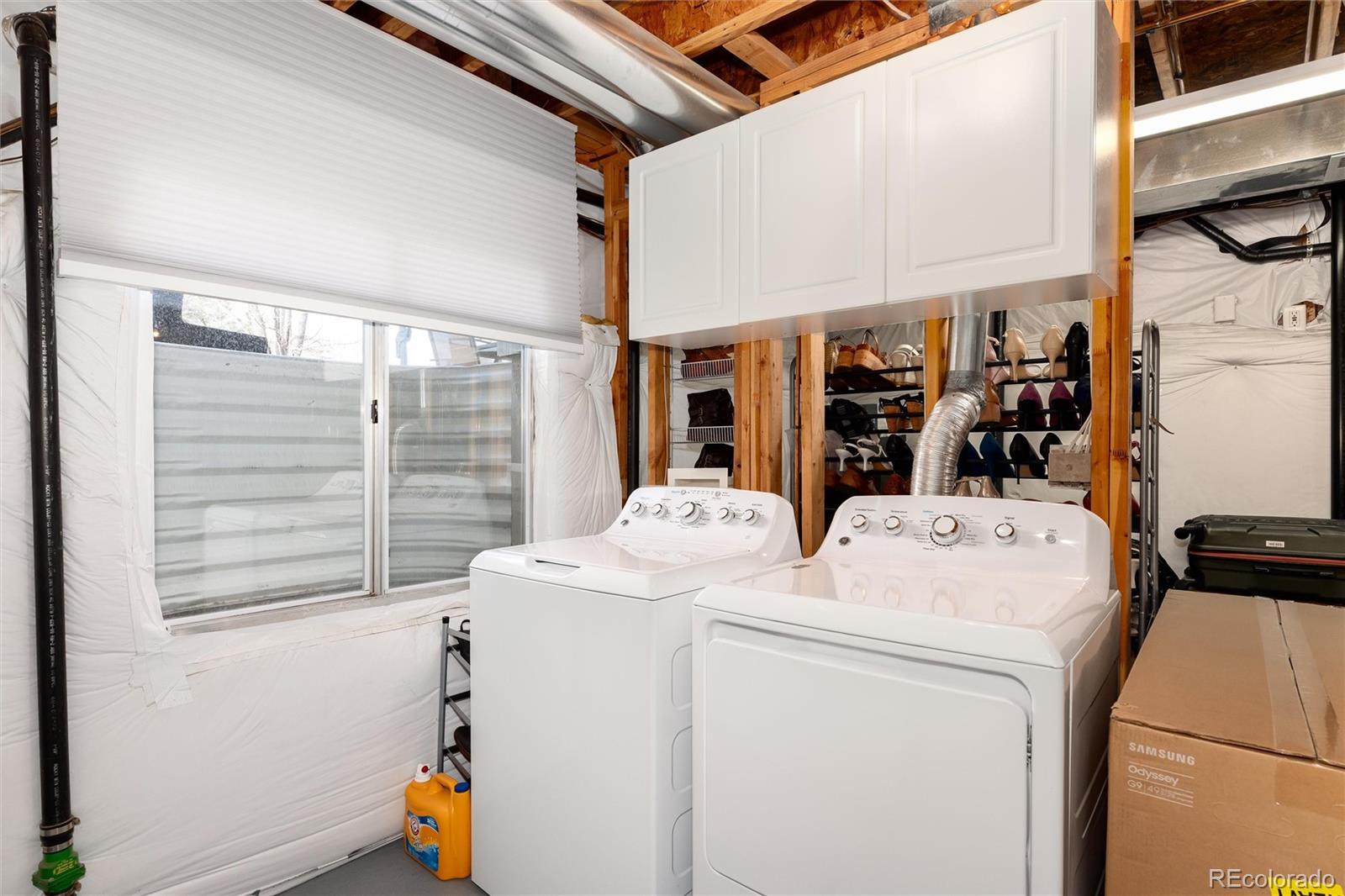 10627 Cherrybrook Circle Highlands Ranch, CO 80126 - Photo 25 of 44 a utility room with dryer and washer